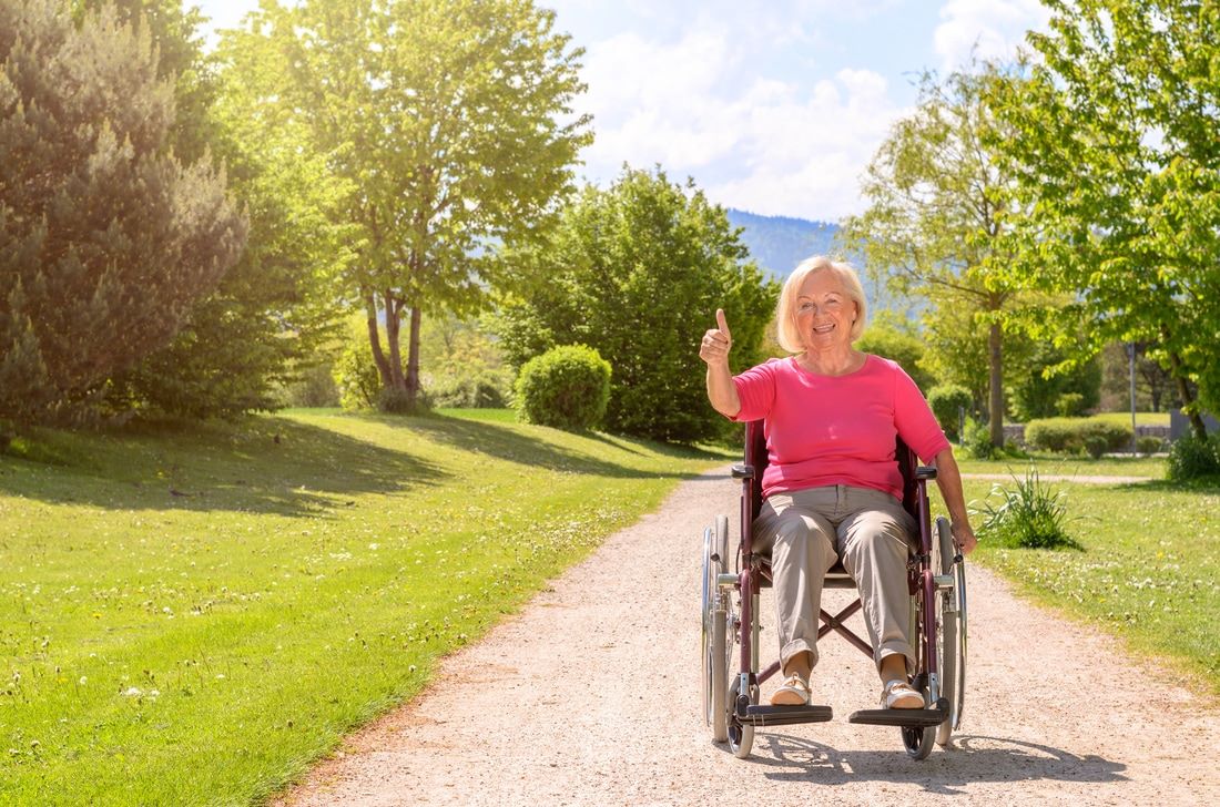 Woman in a wheelchair in the park